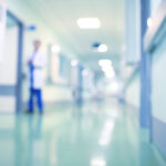 Doctor in hospital corridor, unfocused background Healthcare