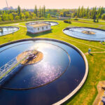 Aerial view to sewage treatment plant. Grey water recycling. Waste management in European Union. Water & Waste Treatment